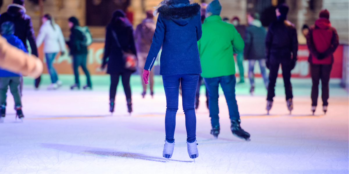 Ice Skating In Coeur D'Alene, Idaho In January Or February. People Having Fun.